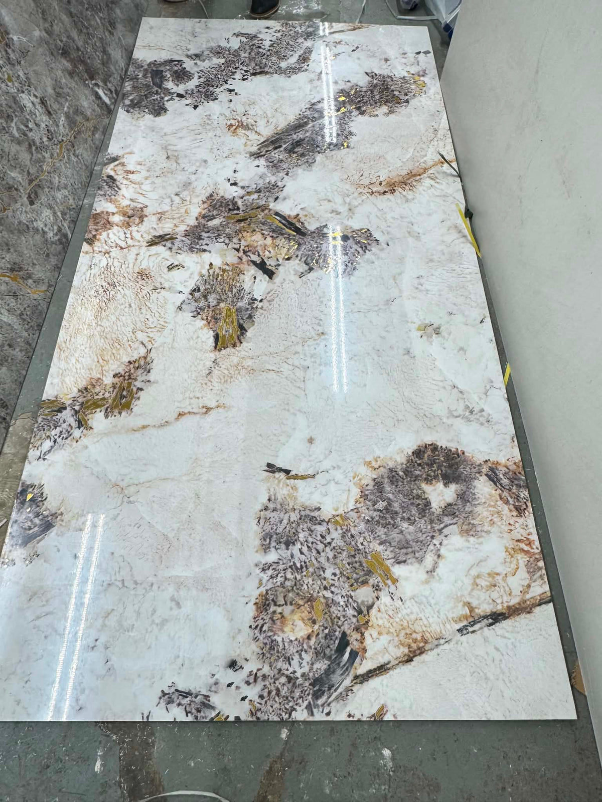Marble effect PVC wall panel with white, grey and gold finish