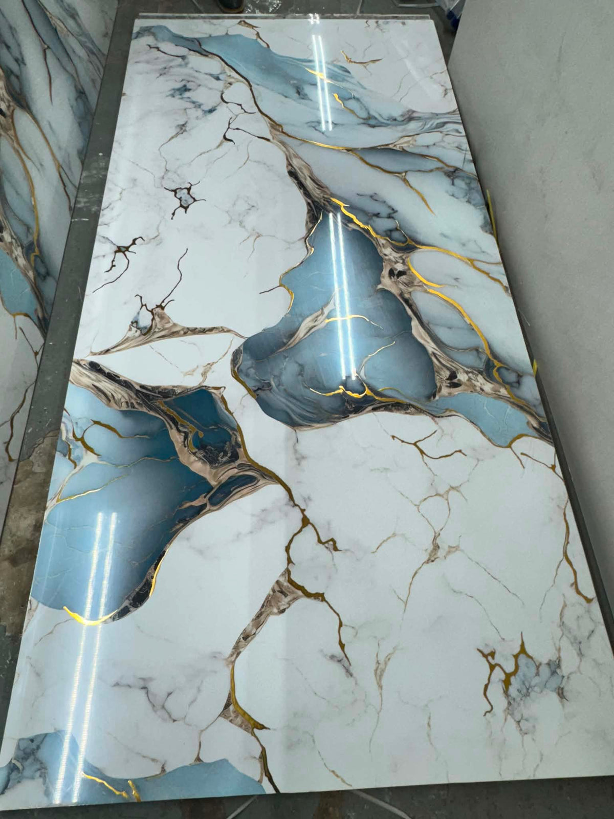 Bamboo Wood Charcoal Veneer PVC Wall Panel with marble effect finish in blue, white and gold